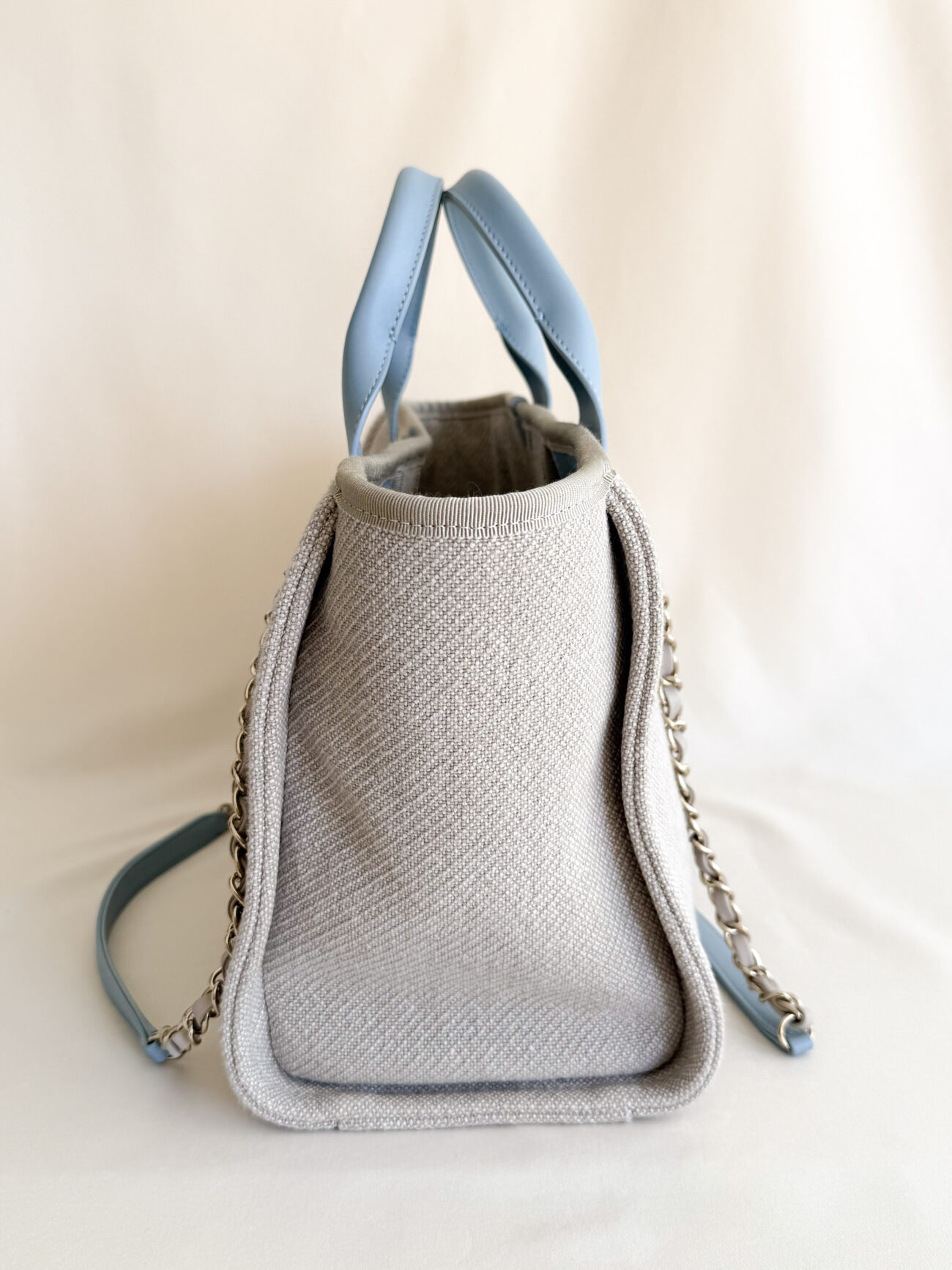 Chanel Deauville Small tote greige canvas with light blue handles and champagne hardware side view