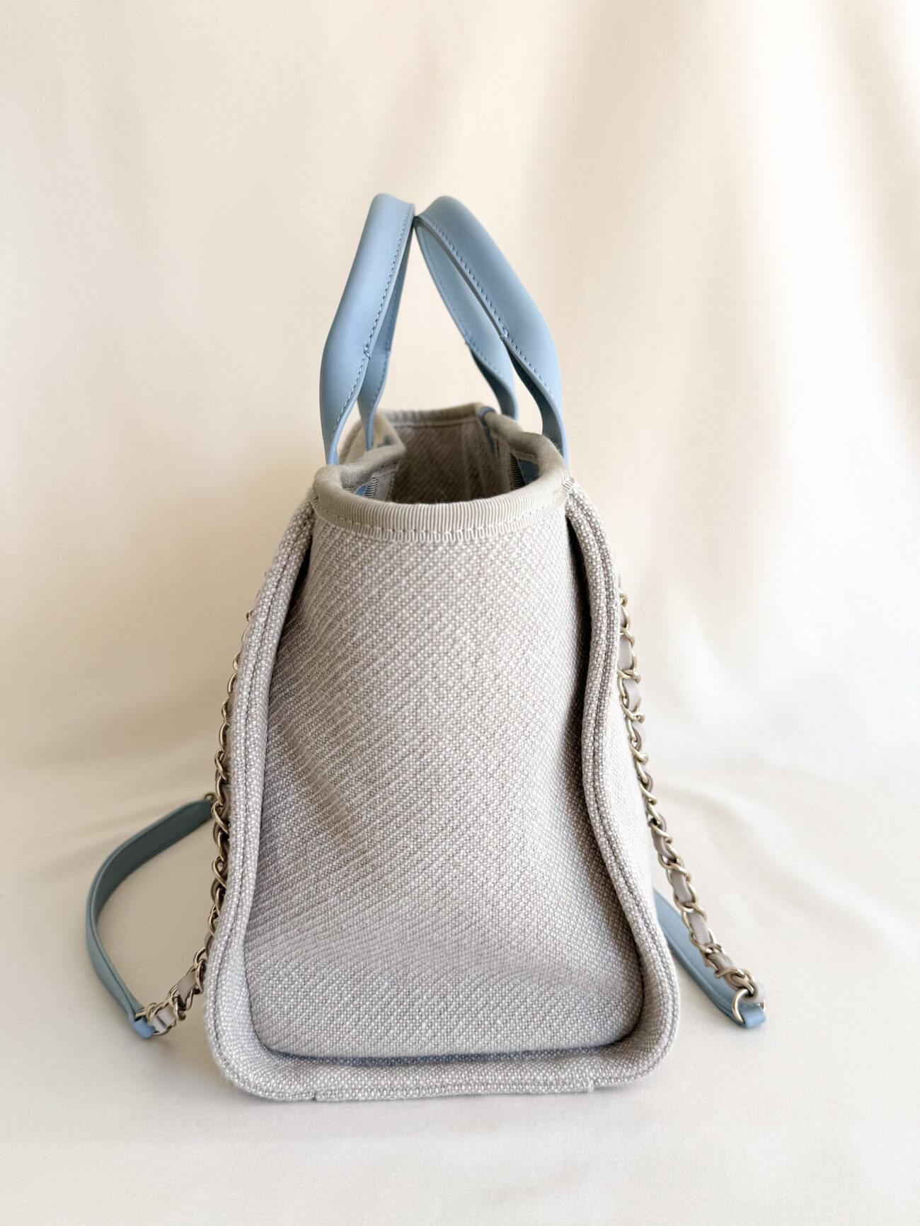 Chanel Deauville Small tote greige canvas with light blue handles and champagne hardware side structure detail