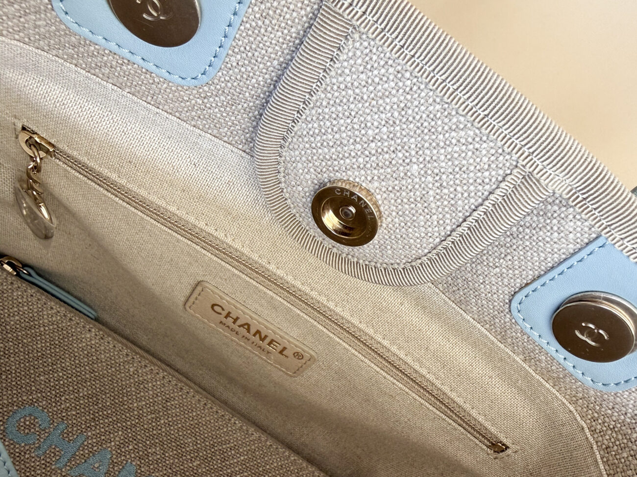 Chanel Deauville Small Tote Greige Canvas interior lining with logo stamp and champagne hardware detail