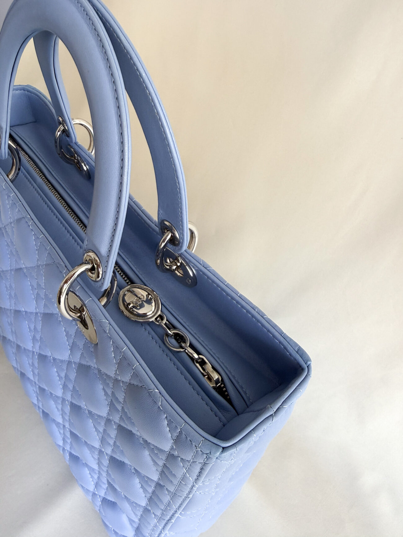 Lady Dior Large Cannage Soft Blue Lambskin with palladium hardware top zip charm view