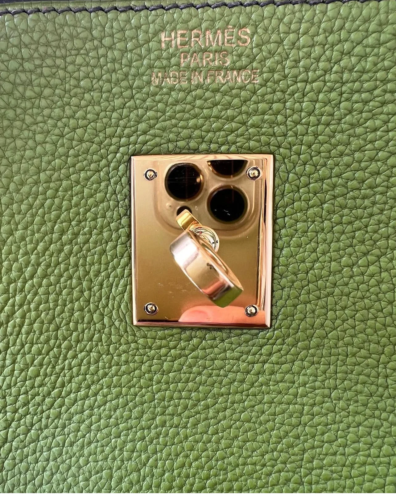 Hermès front stamp closely matching Rose Gold Hardware on a 2007 Hermès bag, collector example.