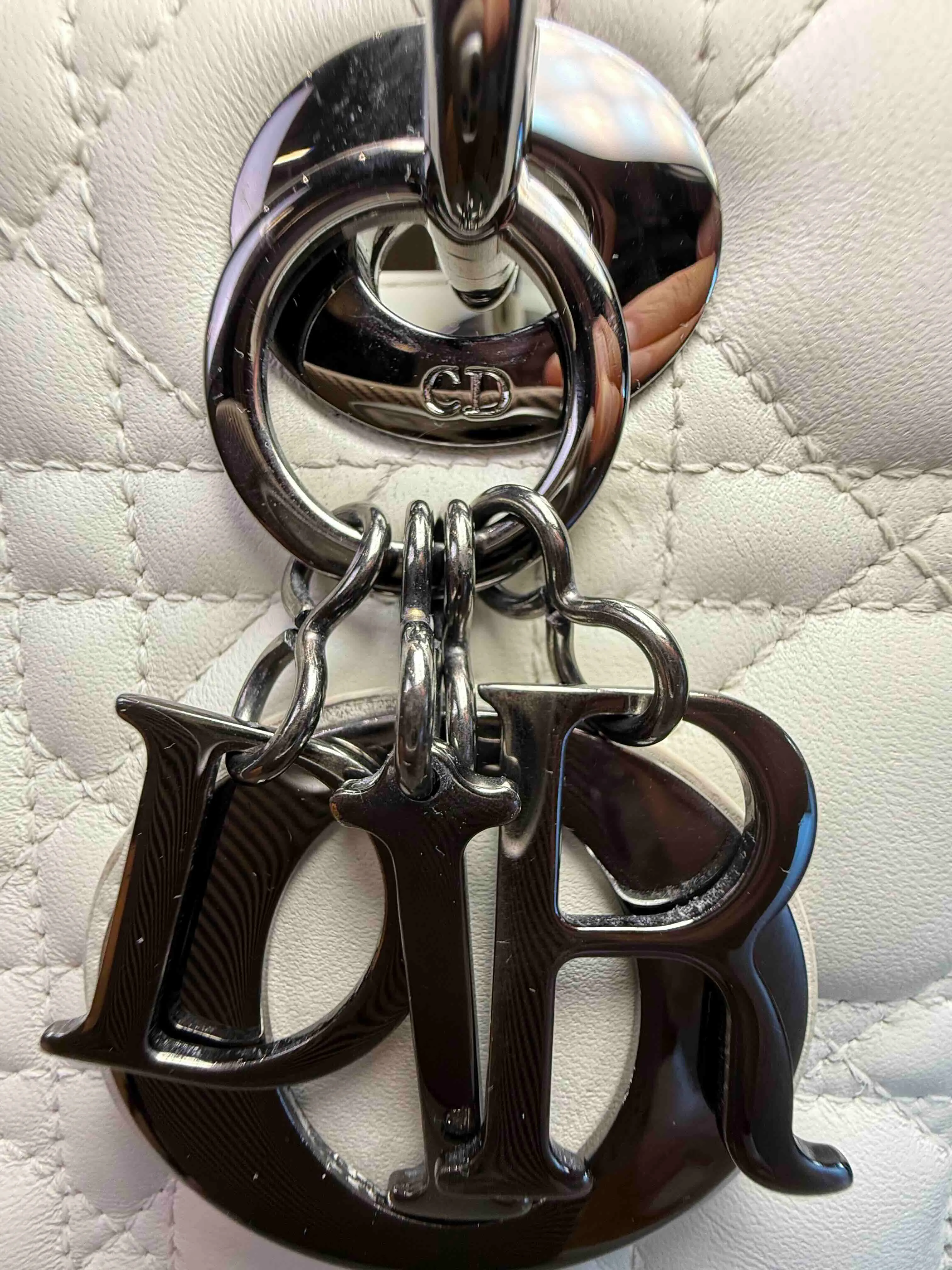 Authentic Lady Dior DIOR charms and hardware detail used for bag authentication.
