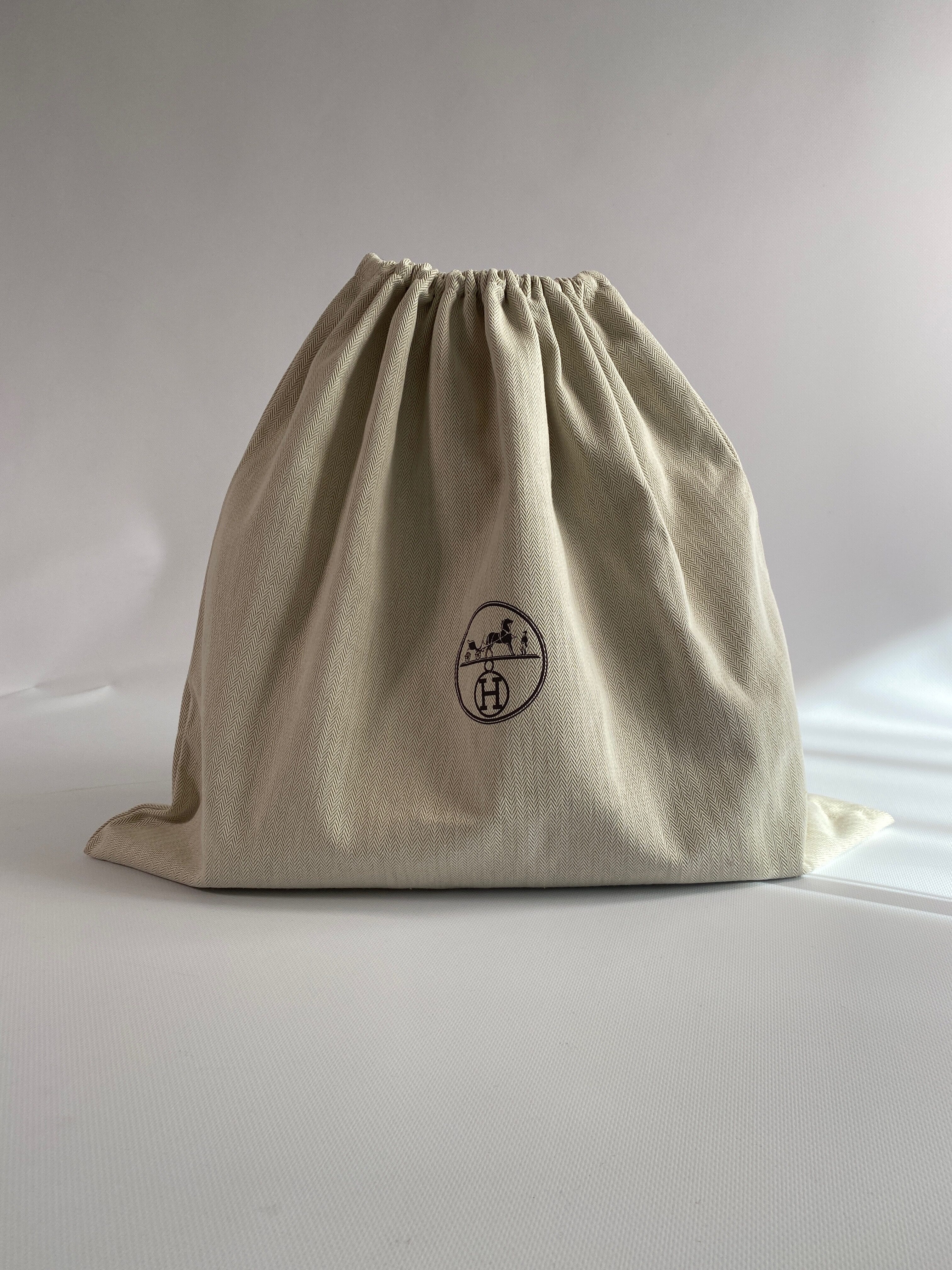 Original Hermès dust bag used for proper handbag storage and protection