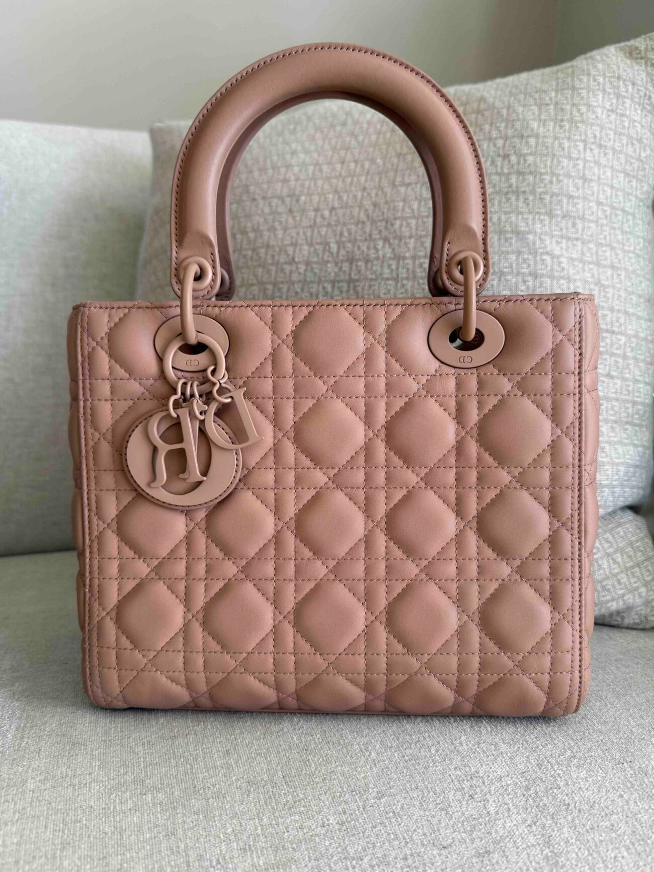 Authentic Lady Dior Ultra Matte bag showing Cannage stitching and signature Dior charms.