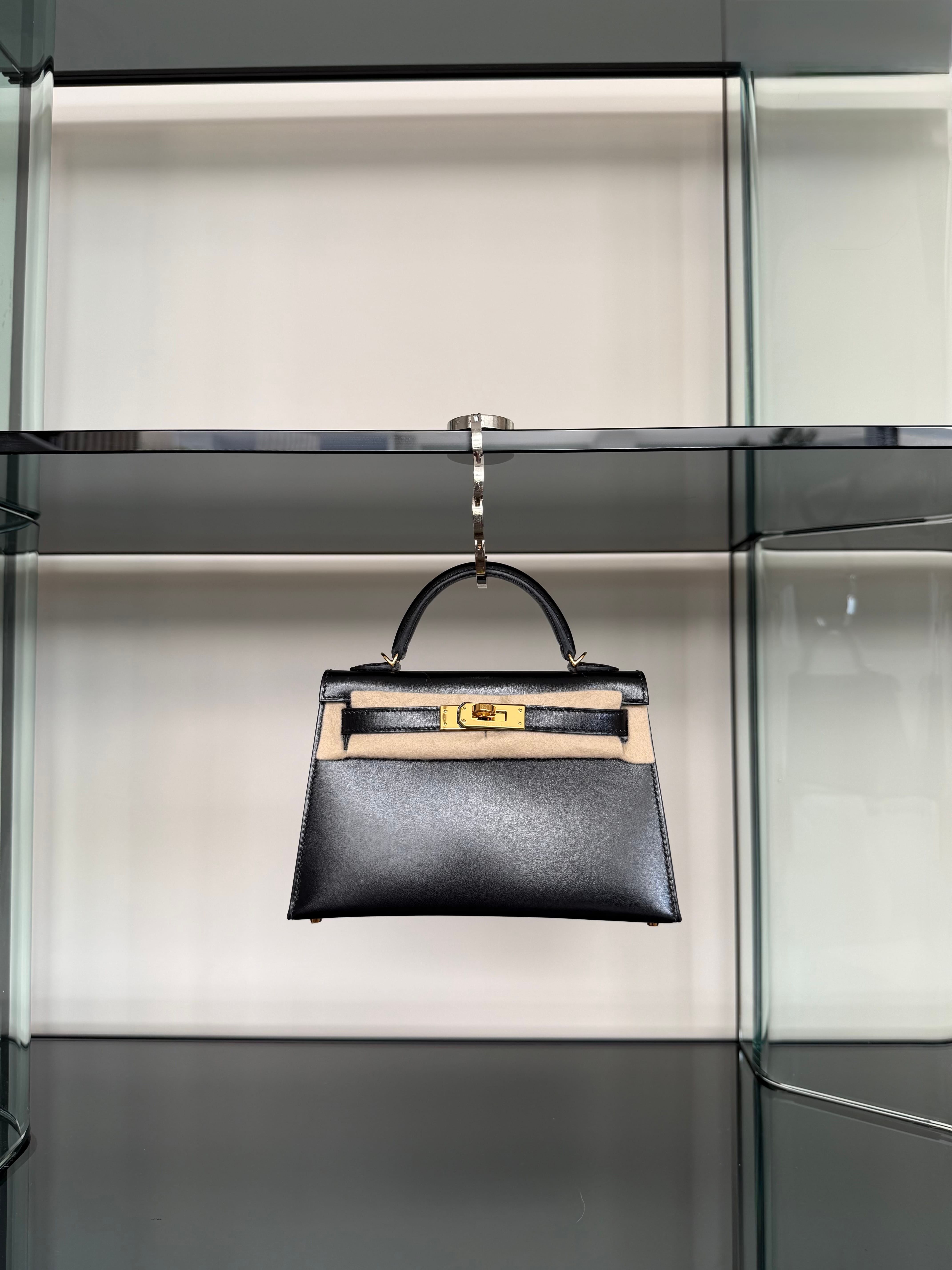Luxury bag hook used to keep a Hermès Kelly off the floor
