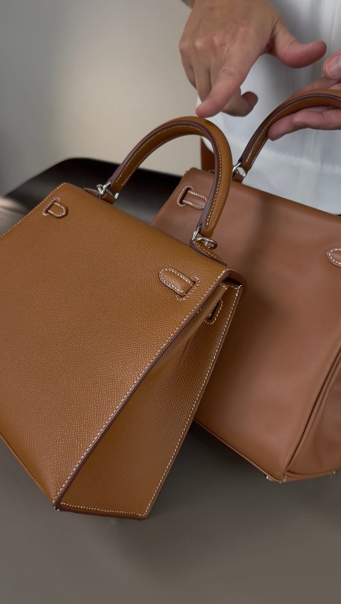 Hermès Kelly bag showing why luxury bags should not be stacked on top of each other during storage, as hardware and locks may leave pressure marks