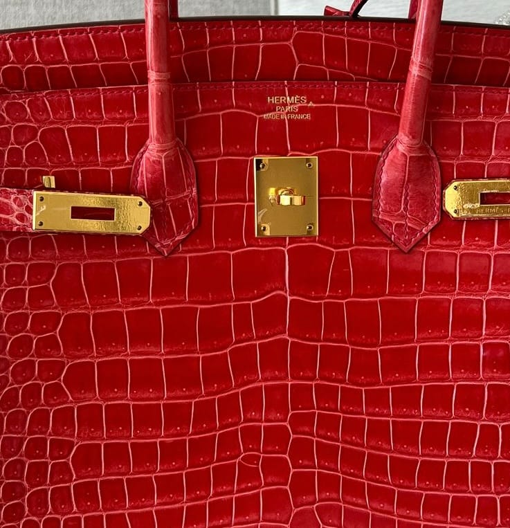 Hermès front stamp with caret mark symbol identifying Crocodile Porosus leather