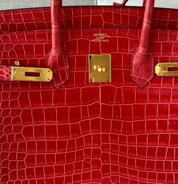 Hermès front stamp with caret mark symbol identifying Crocodile Porosus leather