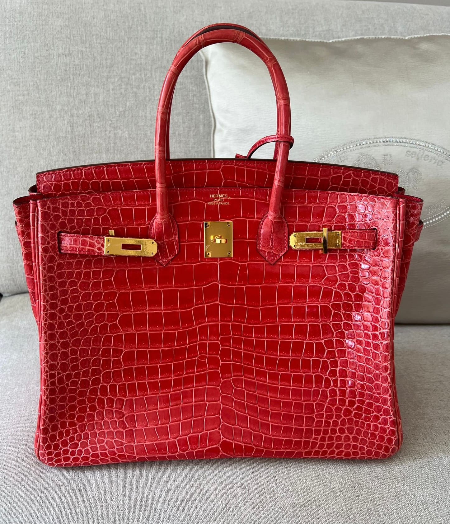 Hermès Birkin bag crafted from Porosus crocodile leather with a glossy finish.