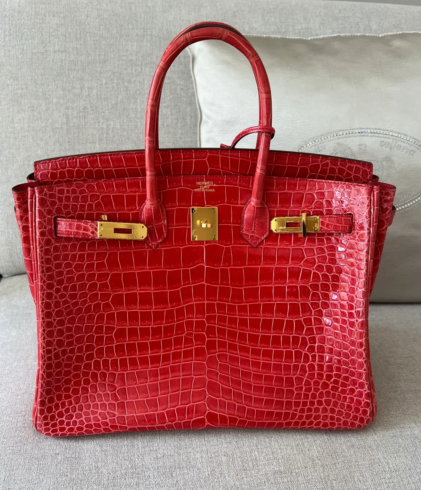 Hermès Birkin bag crafted from Porosus crocodile leather with a glossy finish.