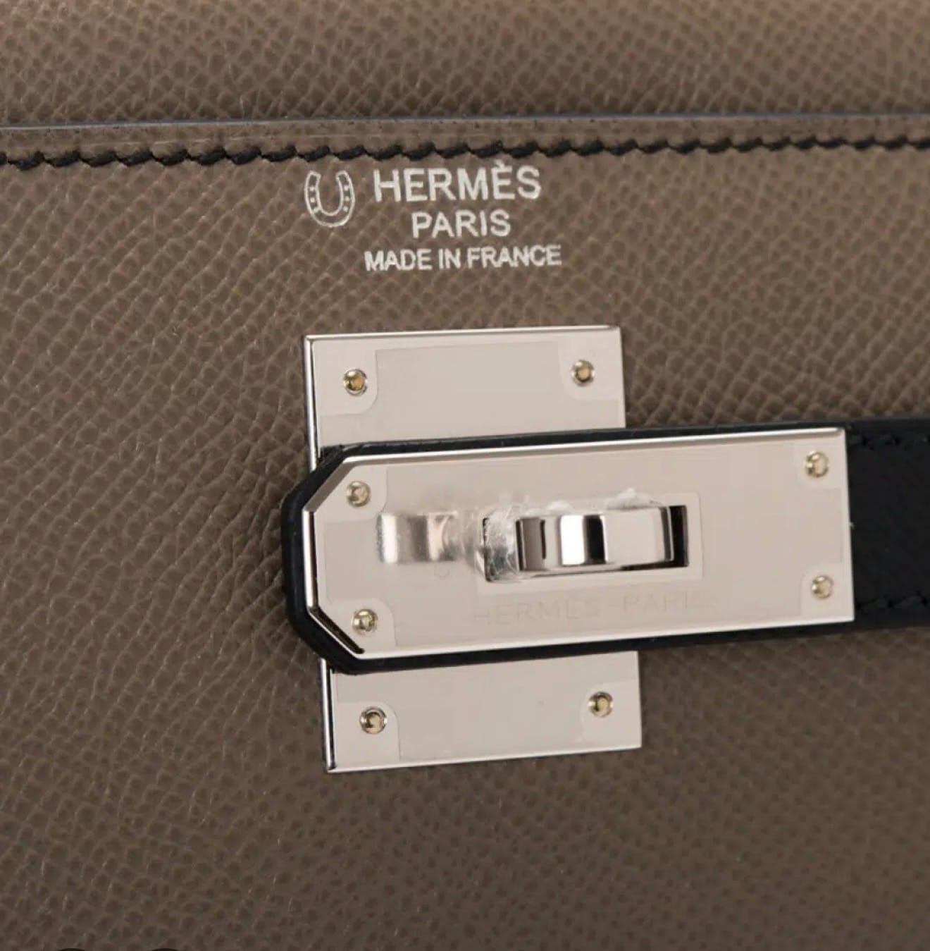 Hermès Horseshoe stamp above the front logo on a Special Order Hermès bag.