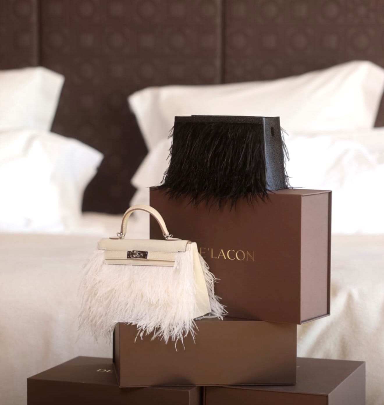 Hermès Kelly bag with decorative feather bag skirt accessory