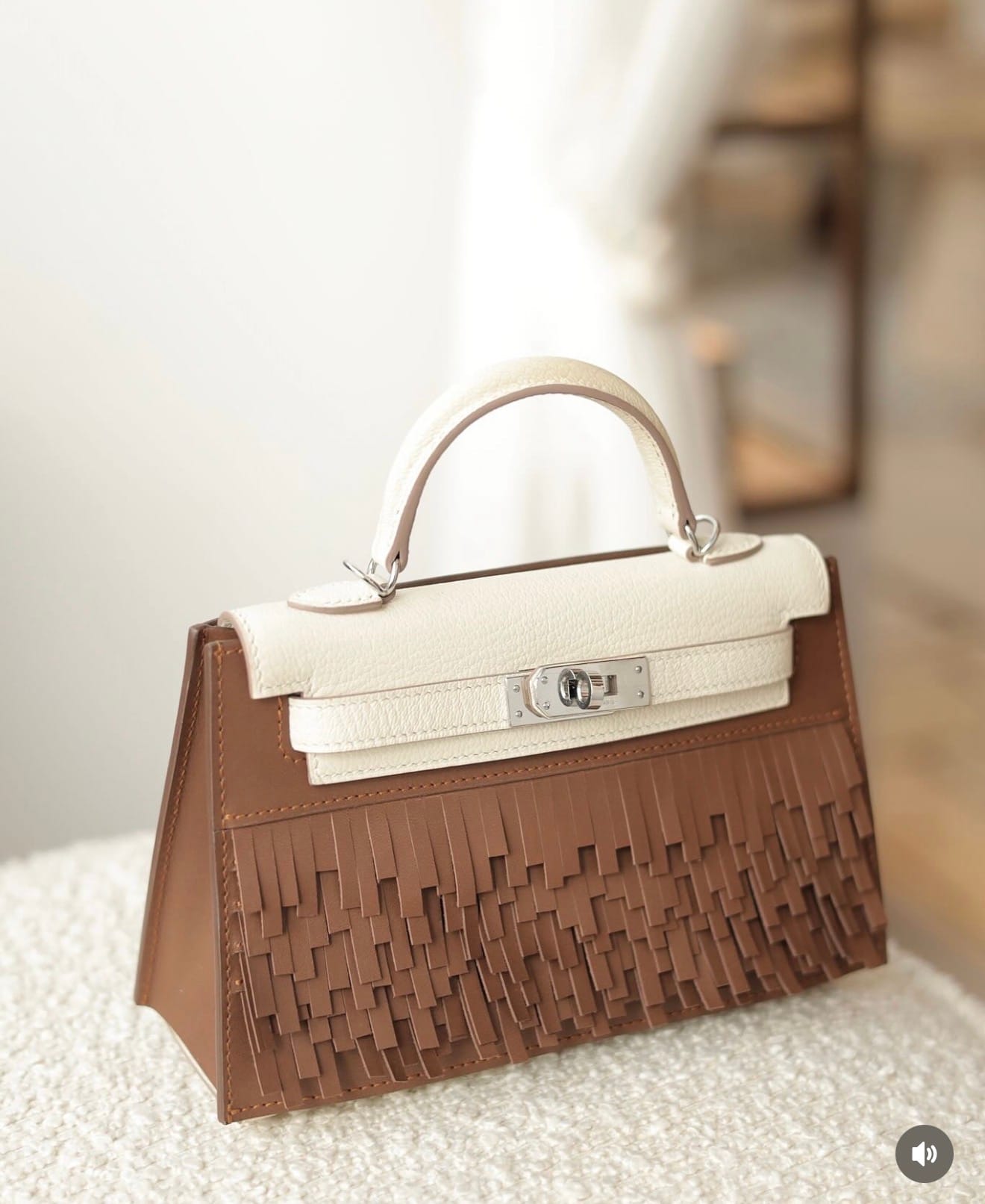 Leather fringe accessory used to personalise and protect a Hermès Kelly bag