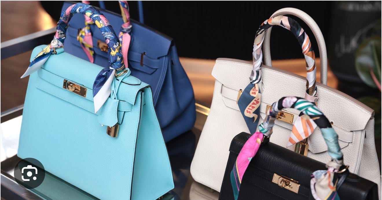 Hermès Kelly bags with Twilly scarves protecting the handles