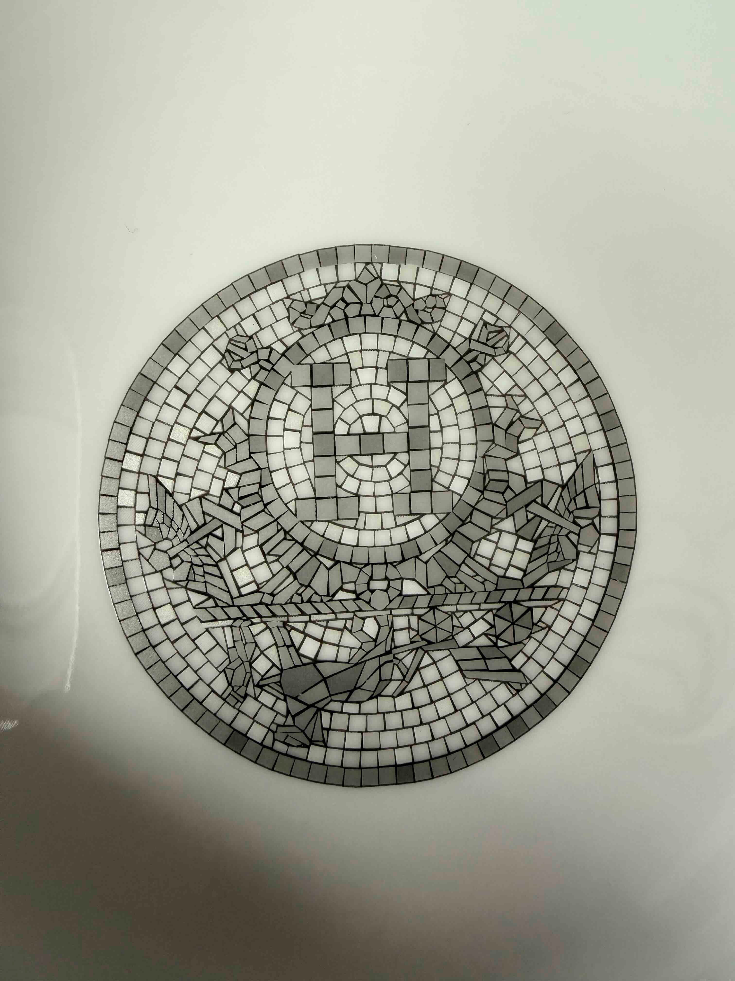 Authentic Hermès Mosaique au 24 Platinum logo detail showing the original dark tile pattern used for authentication