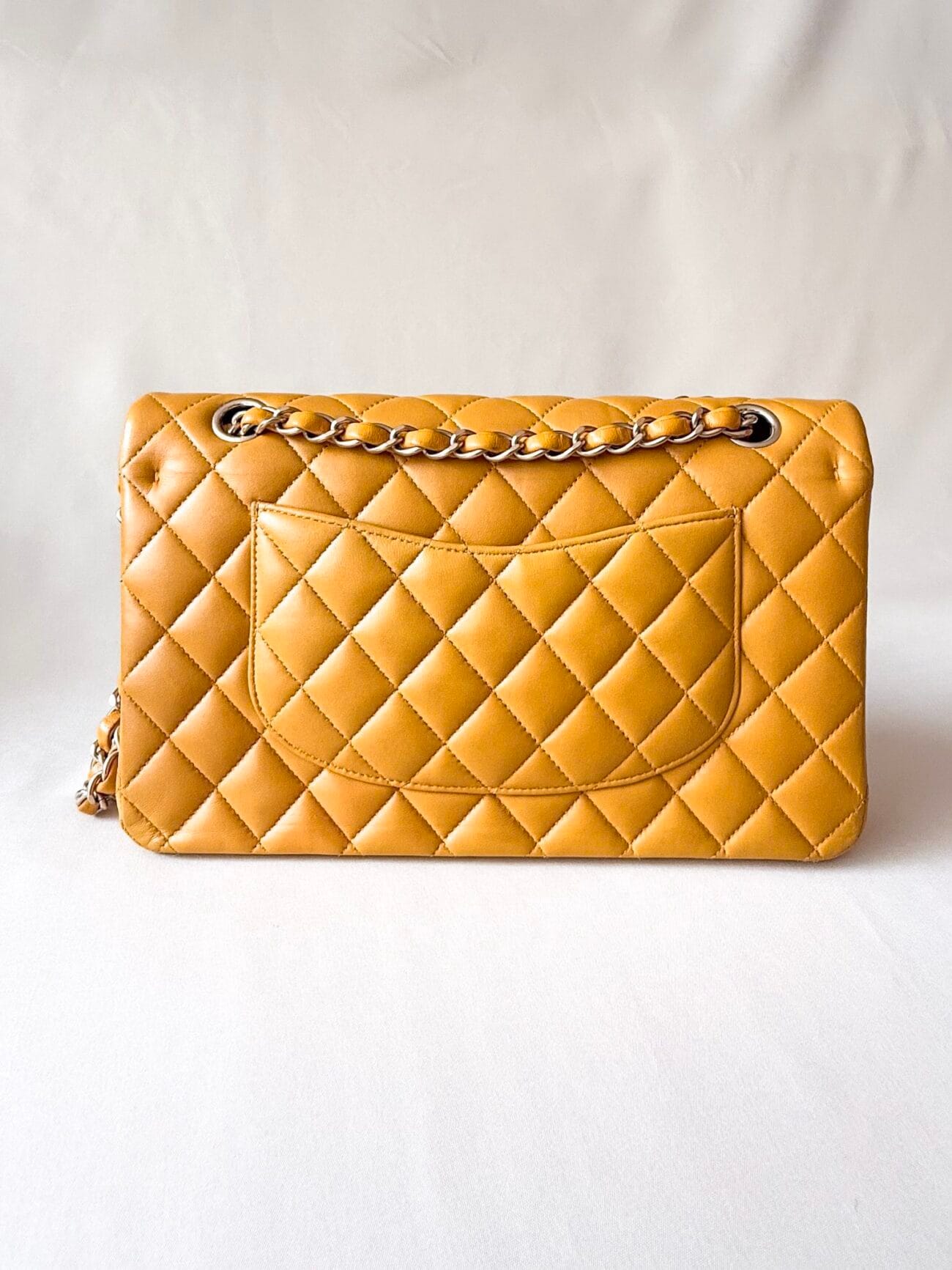 Chanel Classic Flap Medium mustard yellow lambskin back view with Mona Lisa pocket