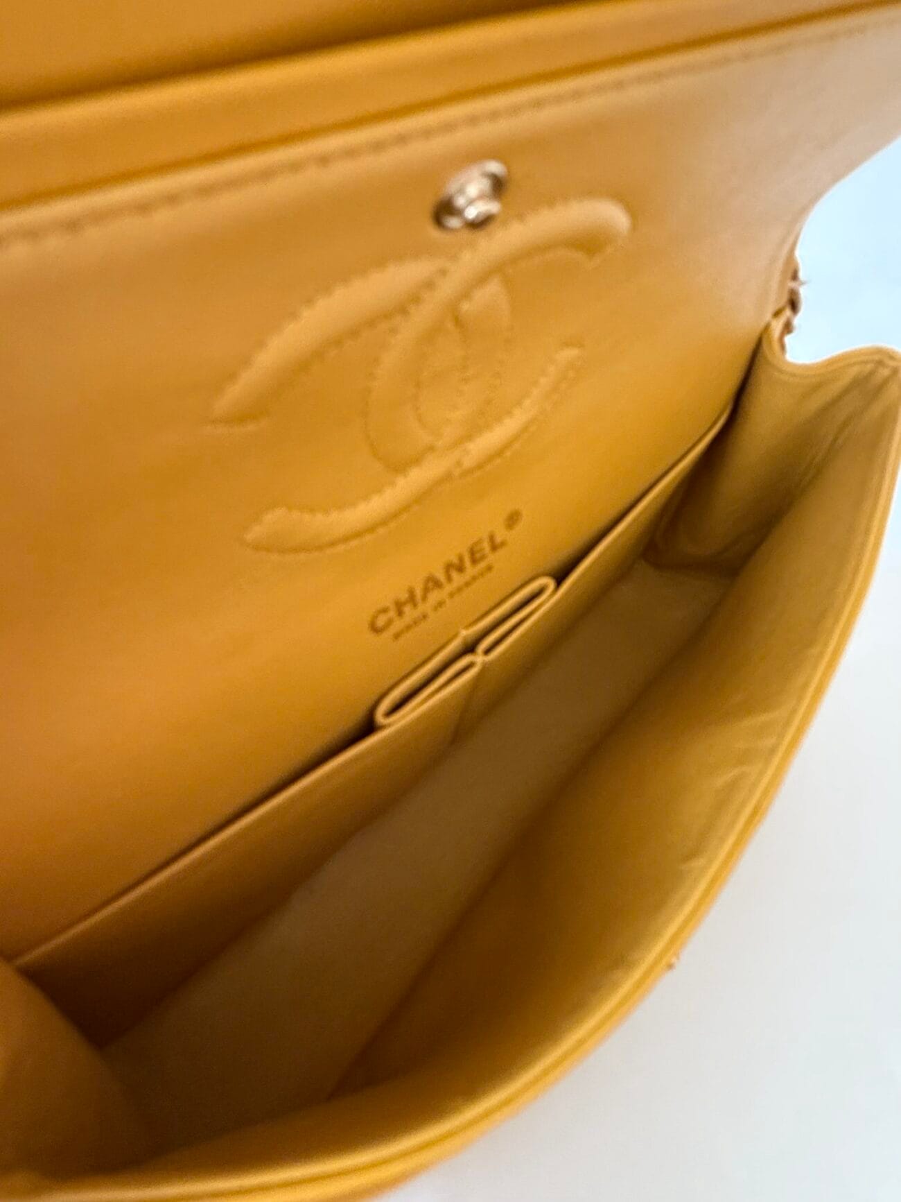 Chanel Classic Flap Medium interior logo and leather lining close-up