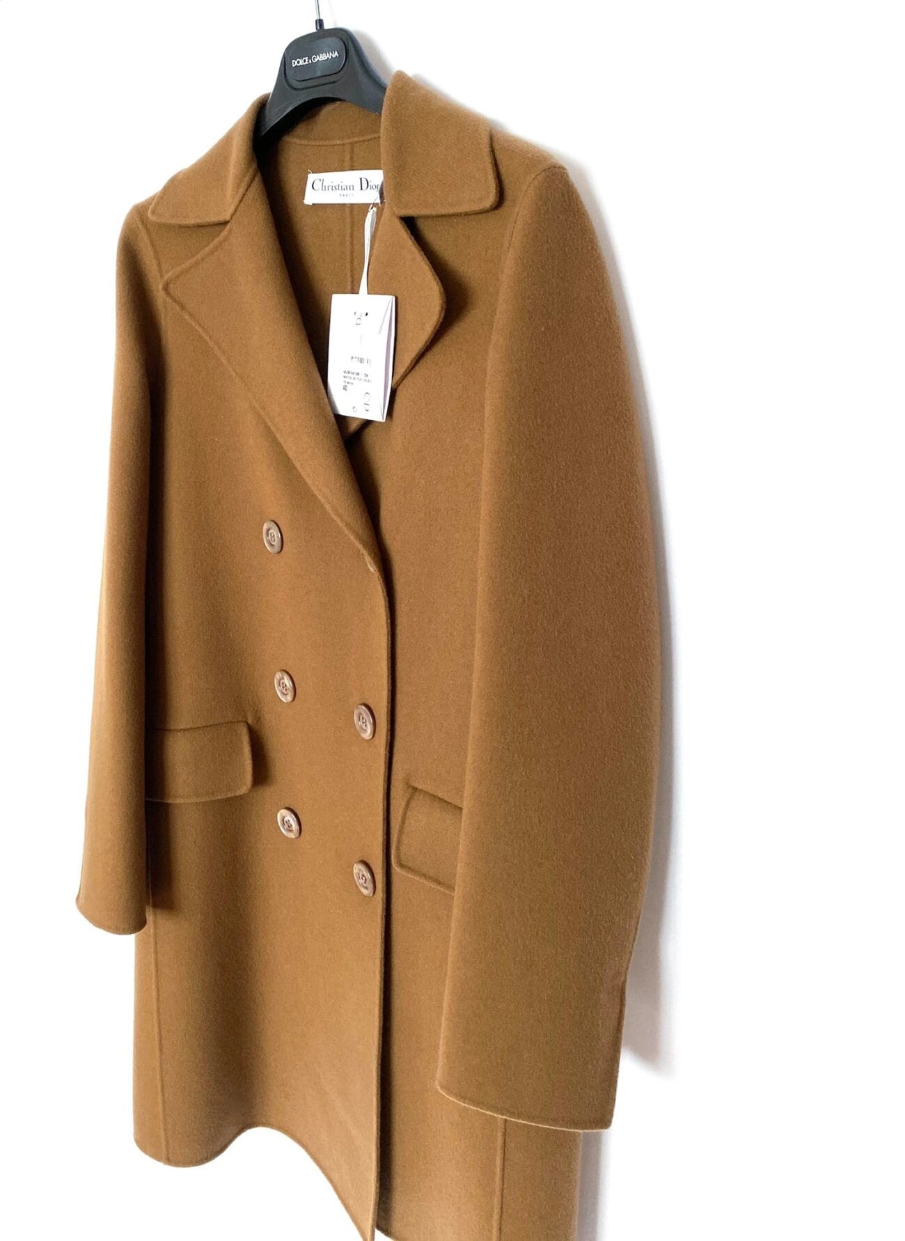 Three-quarter view of Christian Dior camel double-breasted cashmere coat