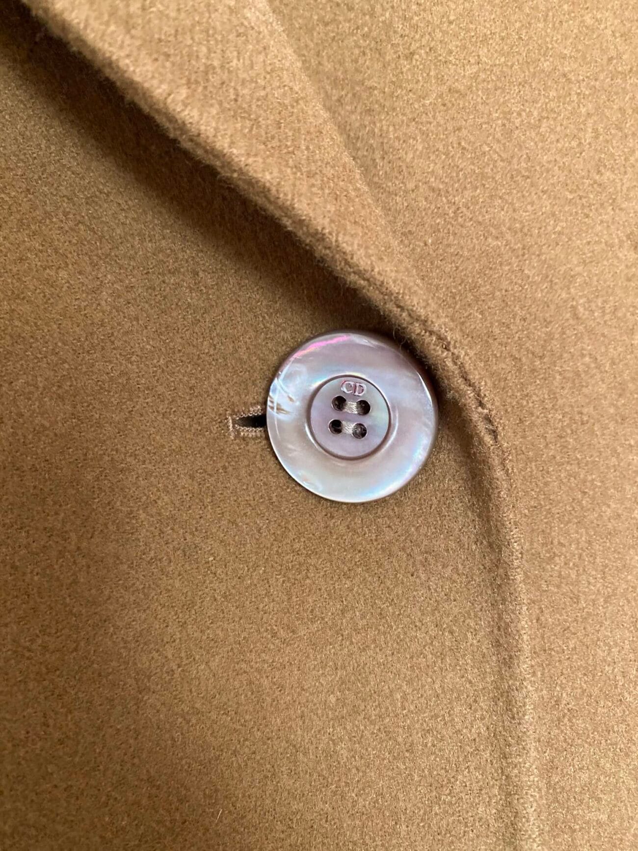 Christian Dior engraved mother-of-pearl button close-up