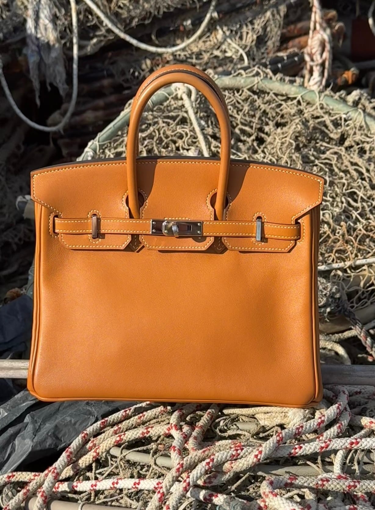 Hermès Birkin 25 in Toffee Swift leather showing the smooth surface, rich colour and soft structure.