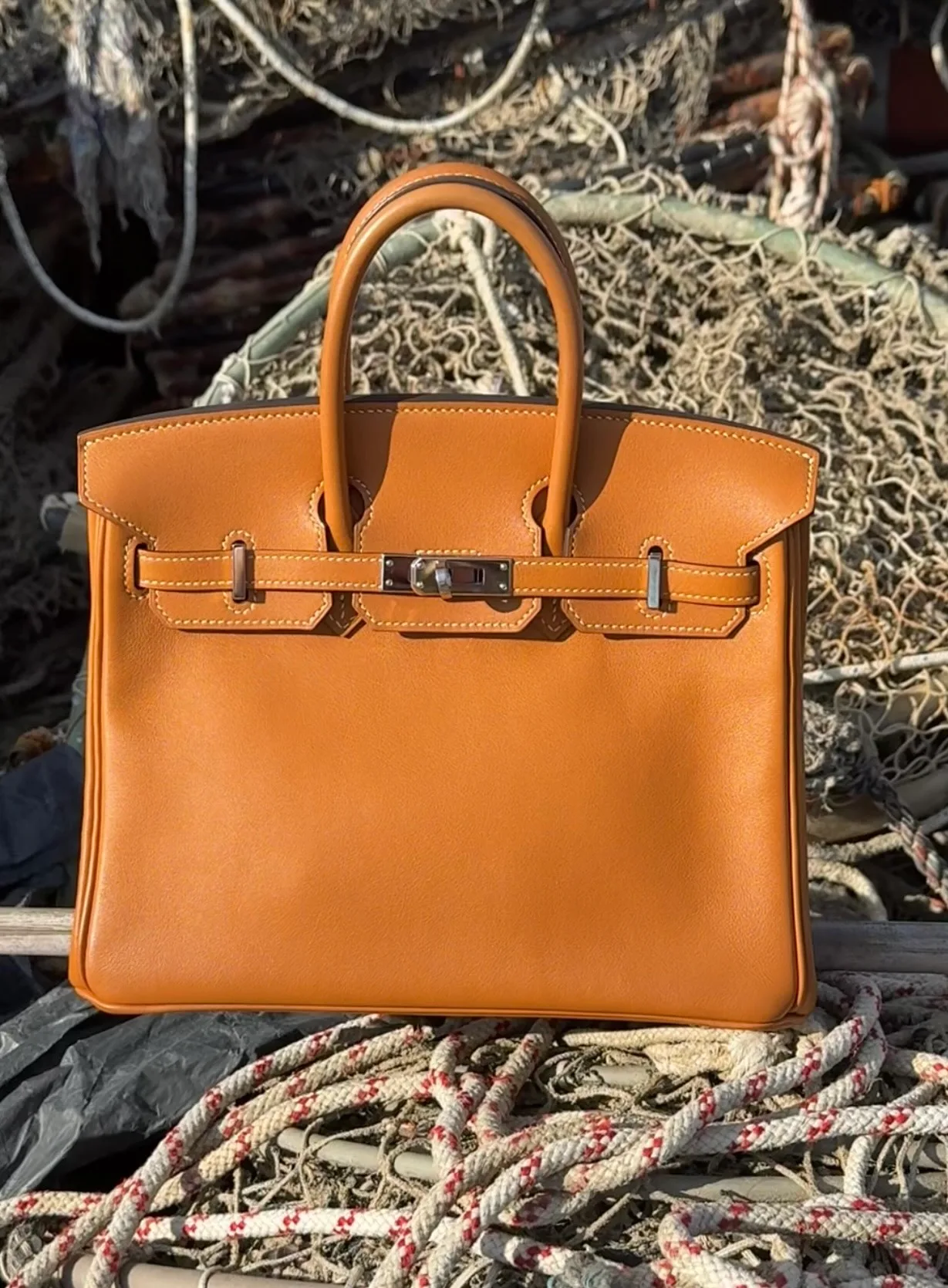 Hermès Birkin 25 in Toffee Swift leather showing the smooth surface, rich colour and soft structure.