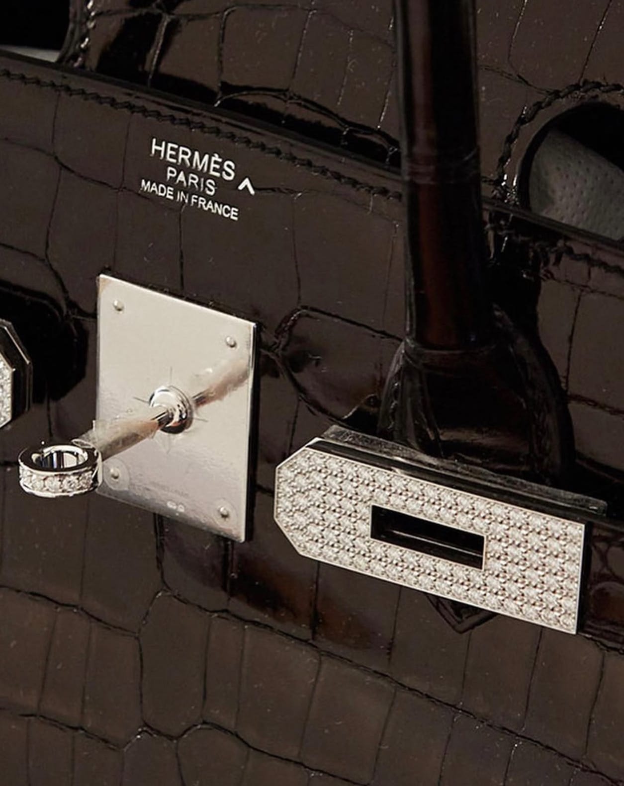 Close-up of Hermès Diamond Hardware turn-lock and lock plate