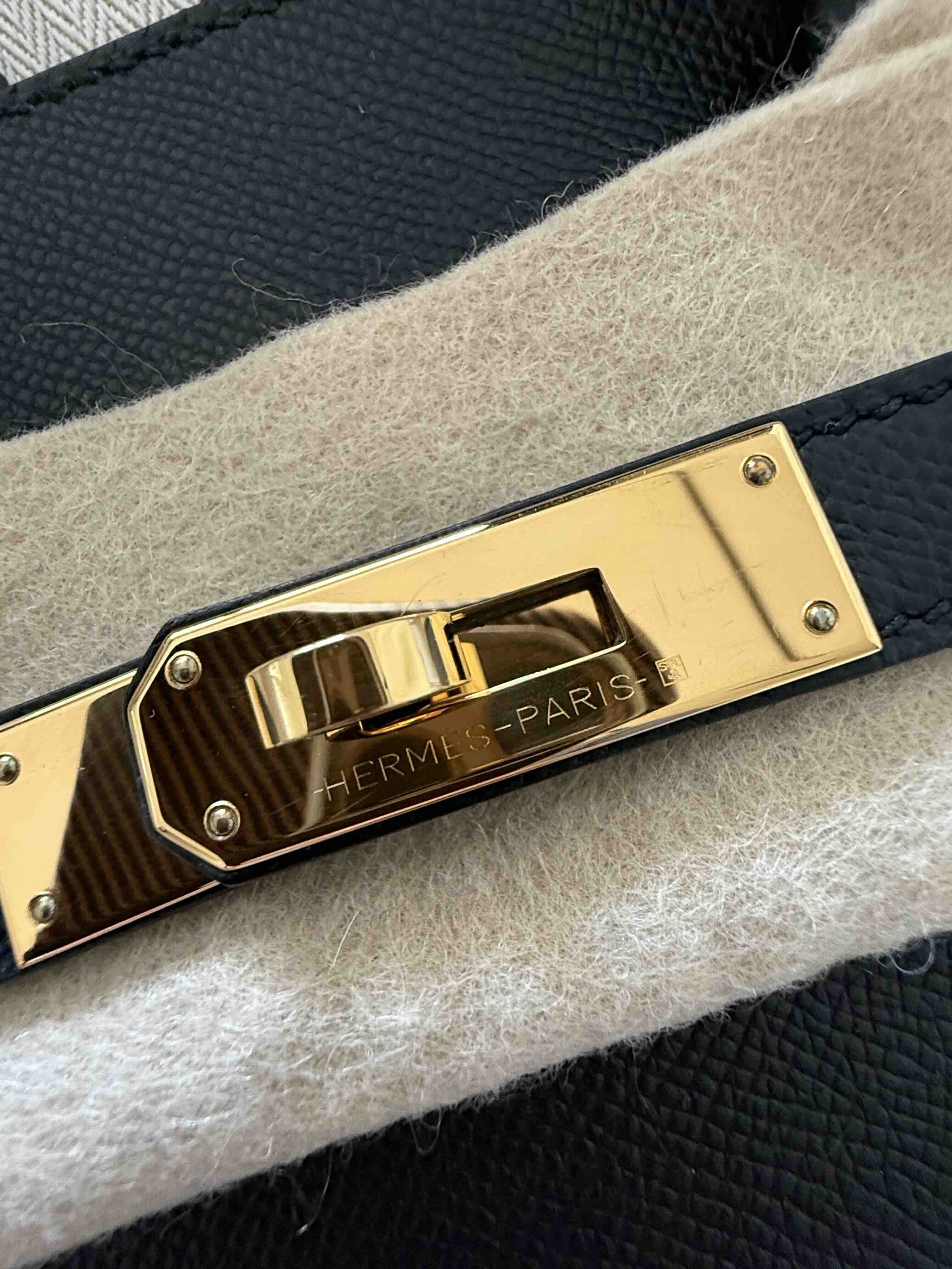 Close-up of Hermès Gold Hardware (GHW) on an authentic Birkin bag