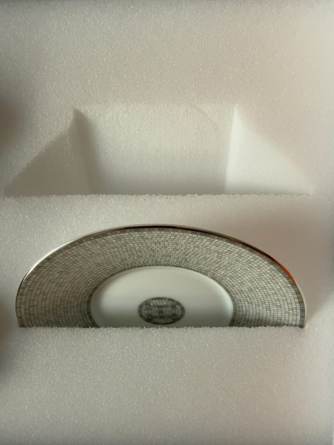 Original Hermès cup packaging showing precisely shaped foam recesses and finger openings