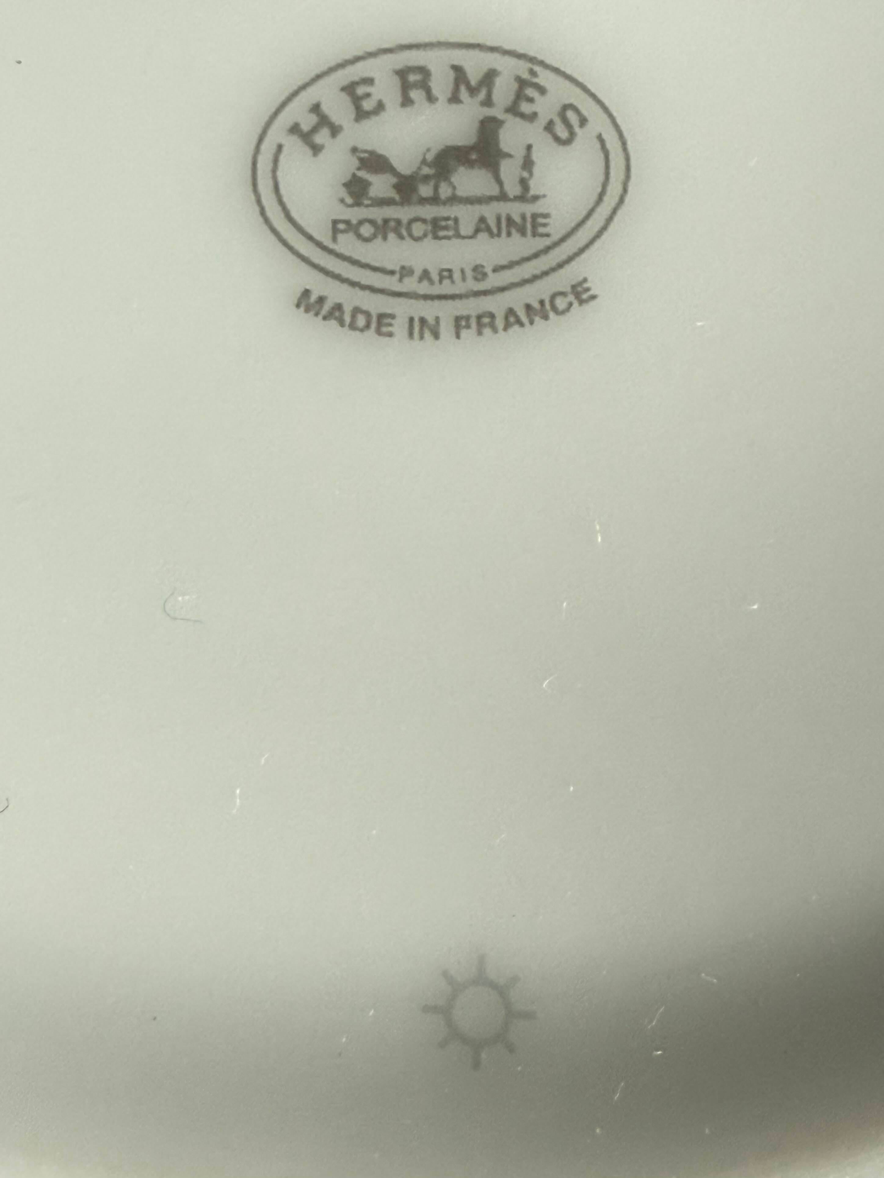 Example of an authentic Hermès Mosaique au 24 Platinum workshop code below the logo